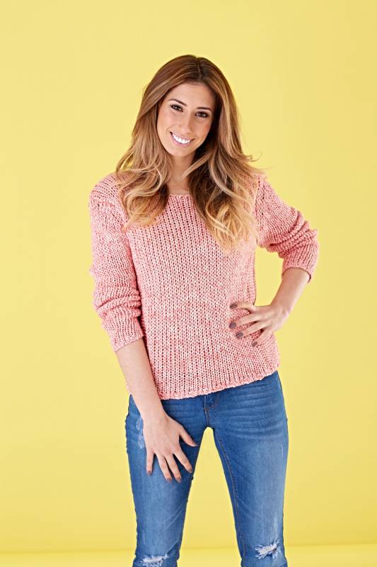 Stacey Solomon in pink knitted jumper and blue jeans