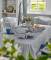 Thumbnail of Kitchen dining table with linen tablecloth and matching cushions